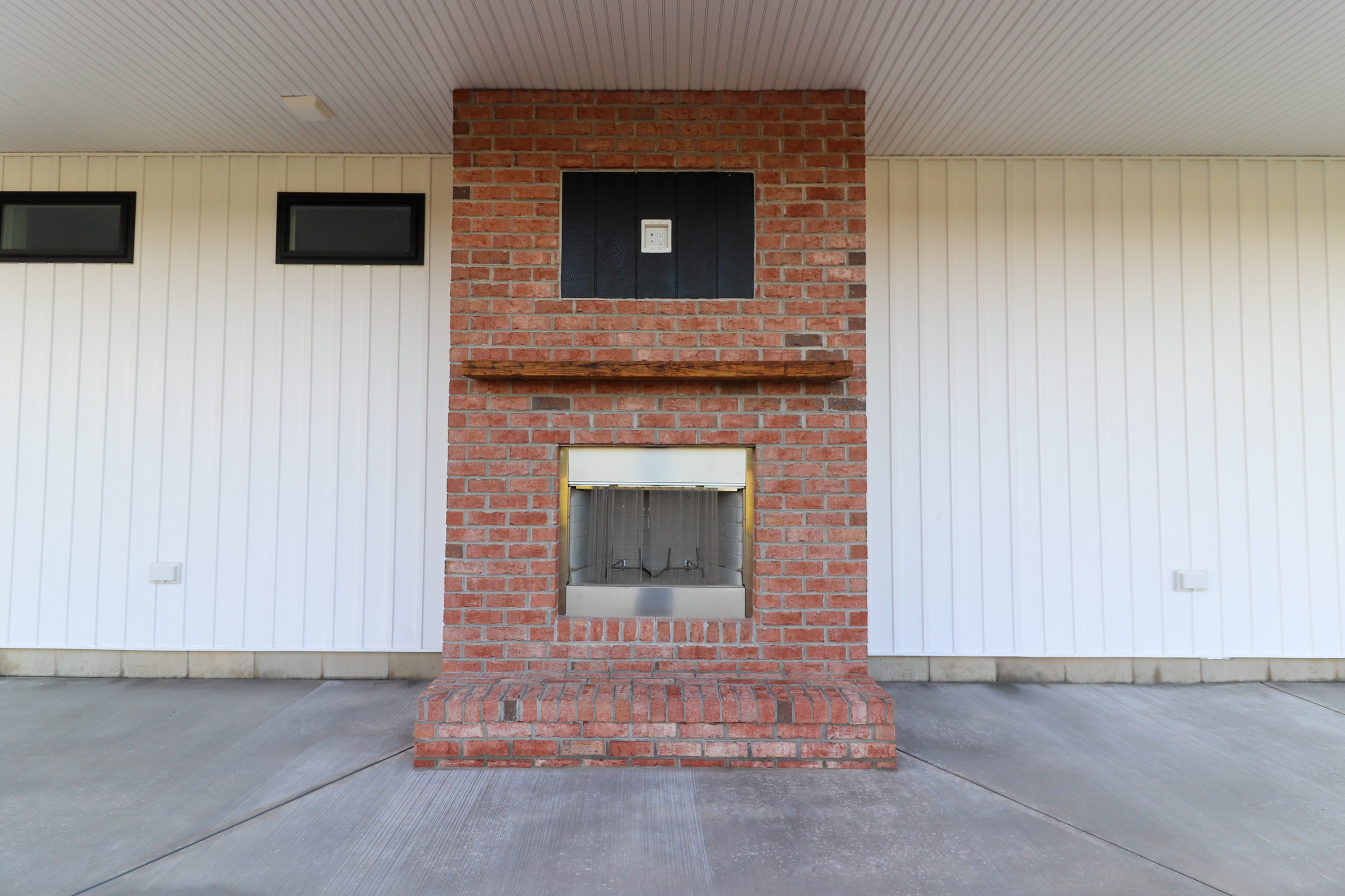 Concrete Porch Brick Fireplace, Seely Homes