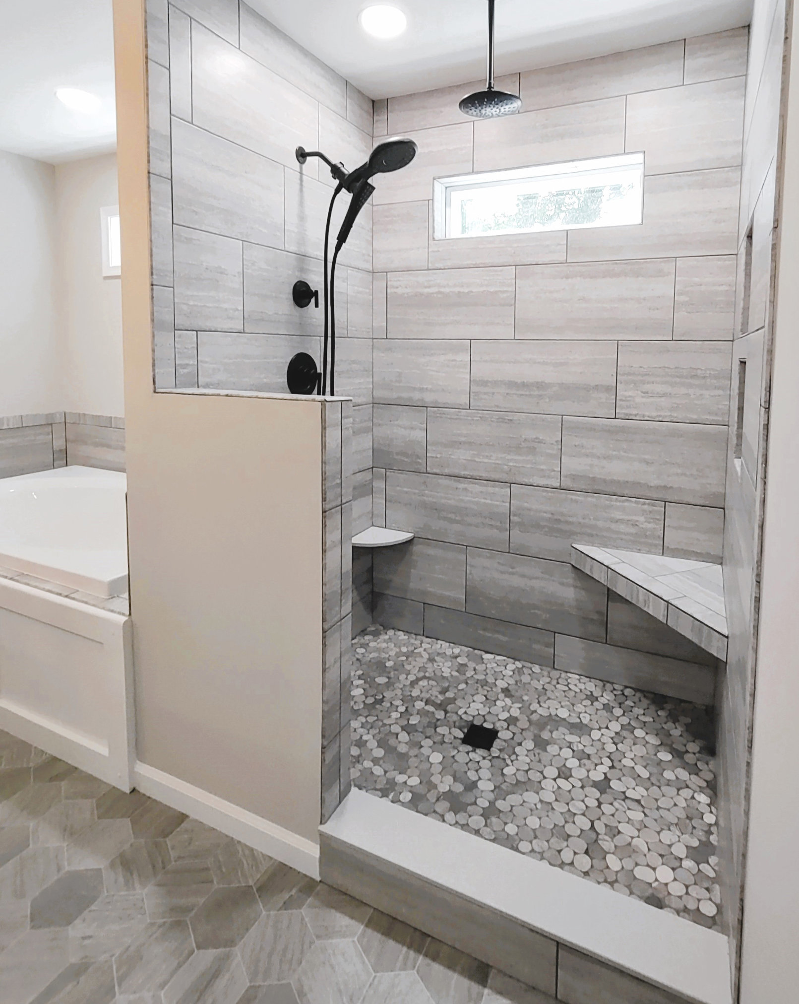 Travertino Tile Shower by Seely Homes