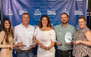 Photo shows the Team at Seely Homes who earned 7 Regal Awards from Delaware Association of Home Builders. Pictured L to R: Cassie Davis, Adrian Seely, Julleanna Seely, Nathaniel Maynard, and Colleen Watson